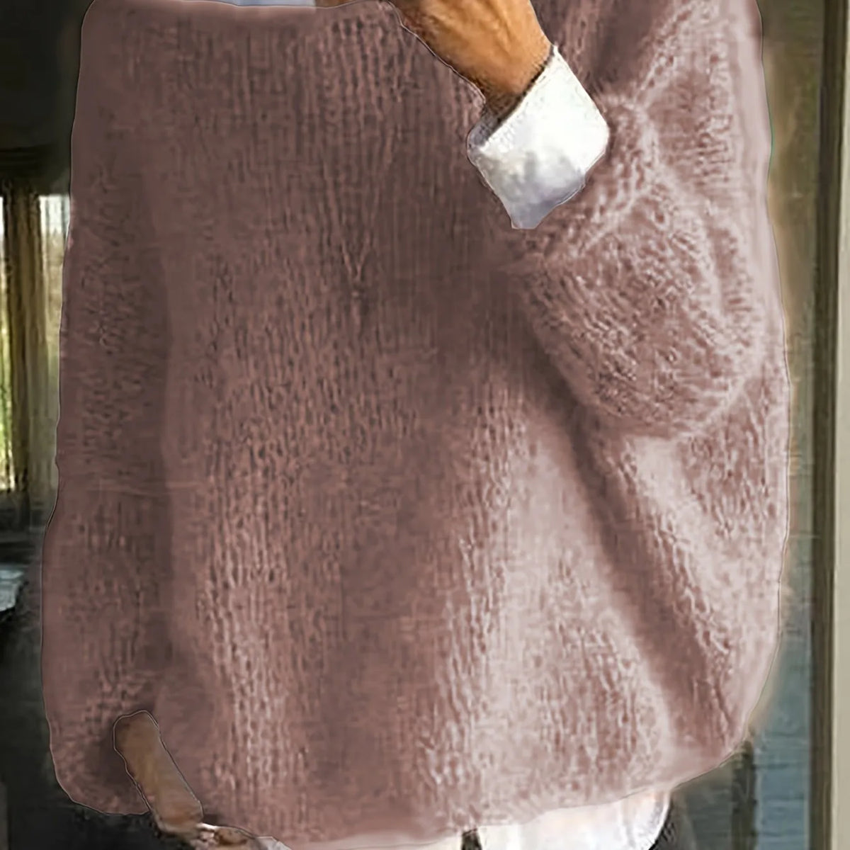 Back view of a dusty rose knitted jumper with a textured fuzzy finish and dropped shoulders on a model