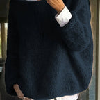 Navy blue oversized knitted jumper with a soft fuzzy texture and long sleeves