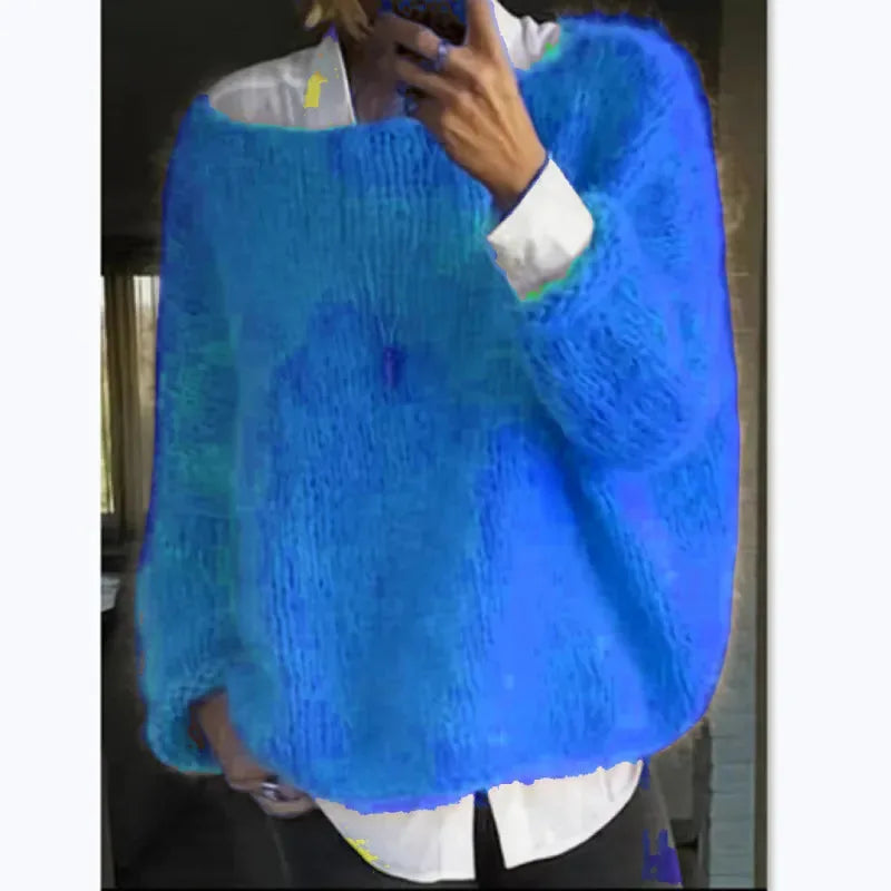 Bright blue mohair-style oversized jumper worn with a white shirt underneath, front view on a model