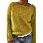 Front view of the bright blue fuzzy oversized jumper layered over a collared white shirt