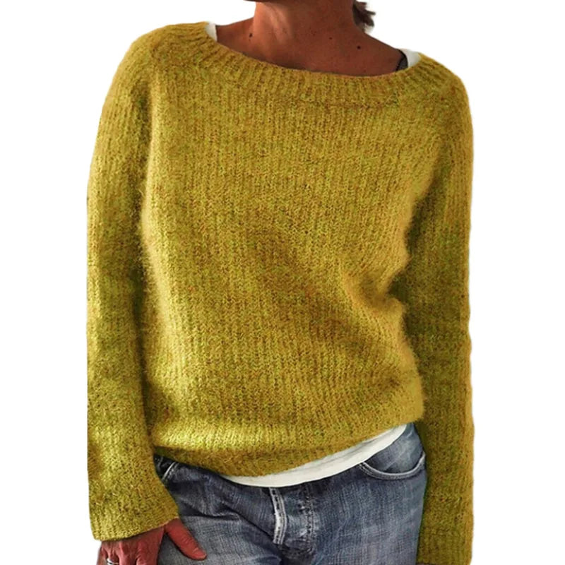 Front view of the bright blue fuzzy oversized jumper layered over a collared white shirt