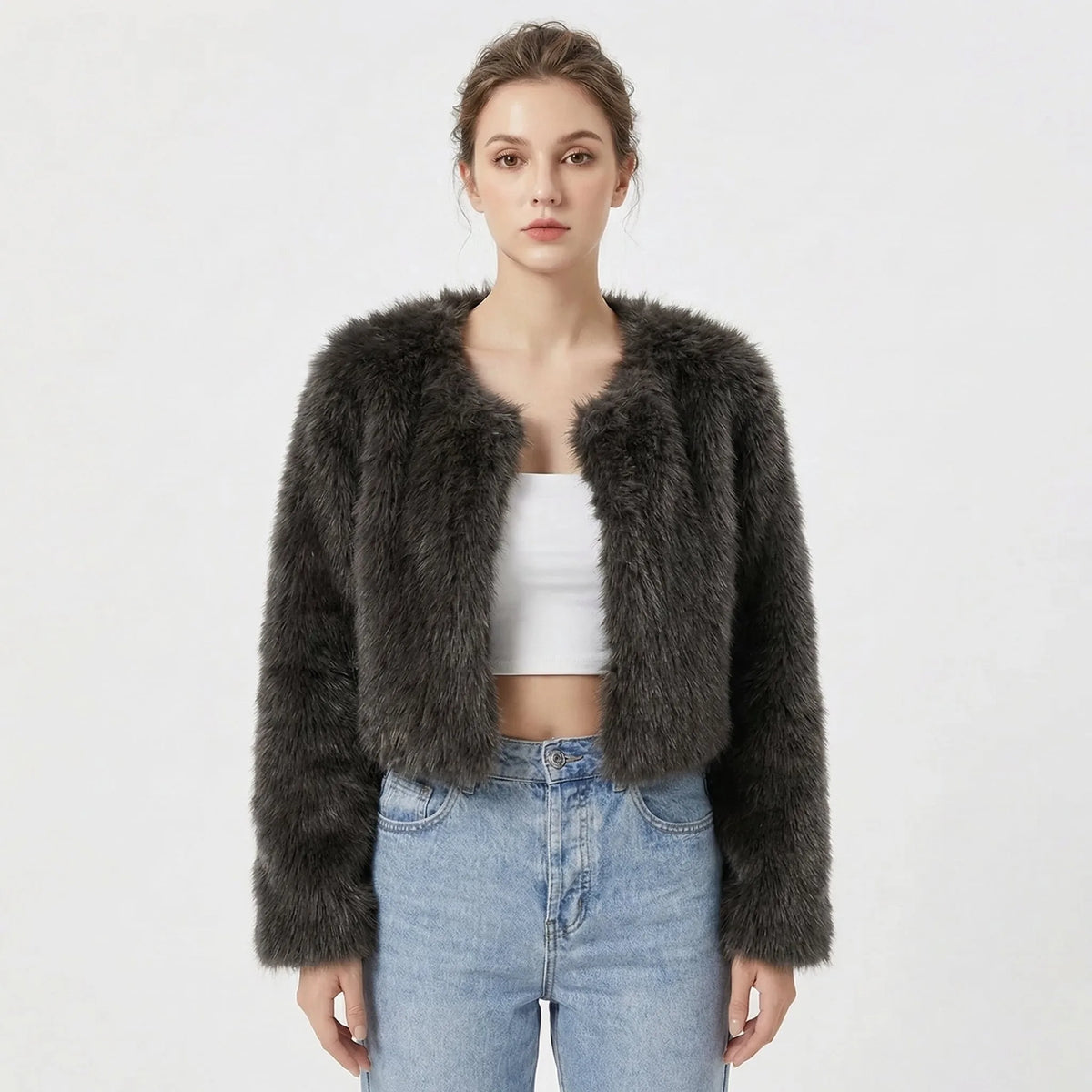 Cropped faux fur jacket in charcoal grey with a shaggy textured finish, shown open over a white top