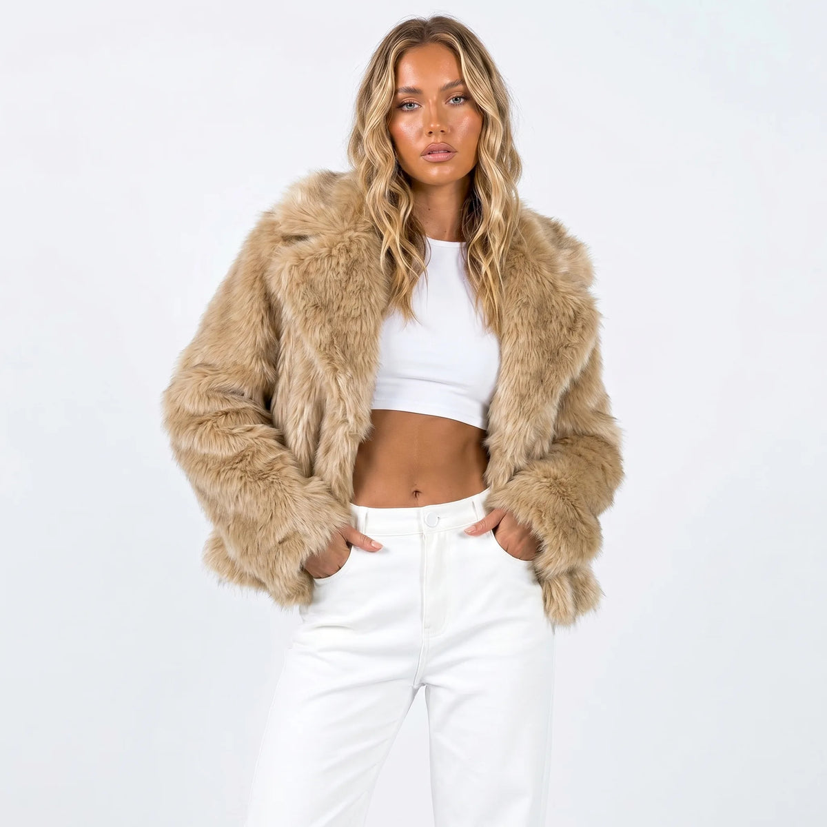 Cropped faux fur jacket in warm camel tone, shown with shawl collar falling open at the front