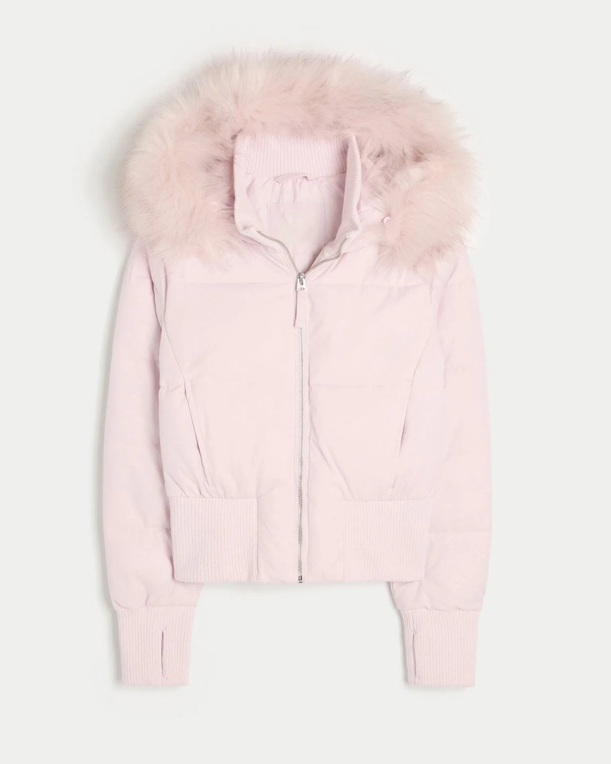 Flat lay of a pale pink cropped puffer jacket with matching pink faux fur hood and ribbed hem.