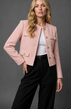 Side angle of the tweed cropped jacket highlighting the structured shoulder and cropped waist length