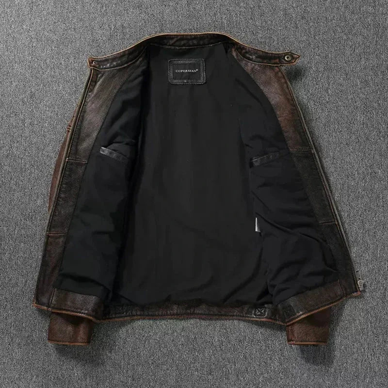 Open brown leather jacket showing black interior lining and inner zip pocket details