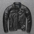 Black leather biker jacket laid flat, open to show black lining, zip pockets and quilted shoulders