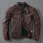 Close-up detail of stitched quilted shoulder panel and worn leather texture in brown finish