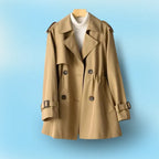 Hazelnut brown trench coat with notched lapel and button front, displayed on a hanger against a blue backdrop.