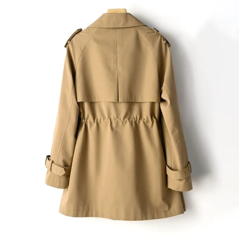 Back view of the hazelnut brown trench coat showing the raglan sleeves and gathered waist seam detail.