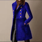 Cobalt blue coat with sleeve button cuffs, notch lapel and soft textured lower skirt