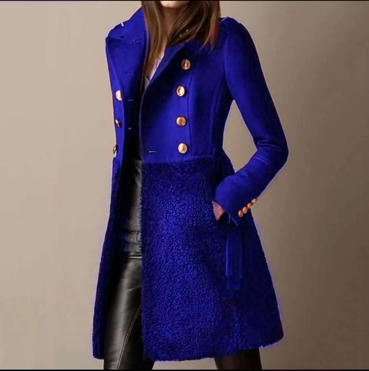 Cobalt blue coat with sleeve button cuffs, notch lapel and soft textured lower skirt