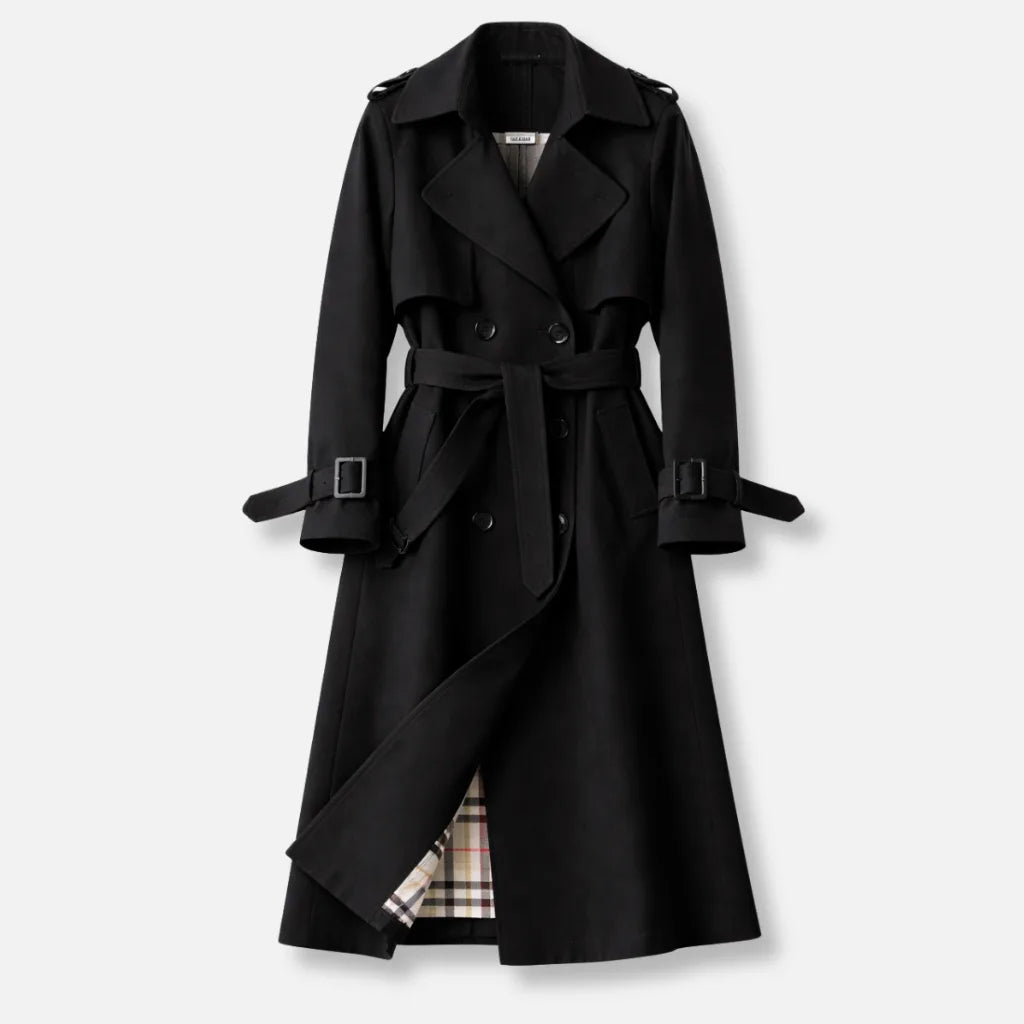 Black double breasted trench coat with wide lapels, tie belt and checked lining peeking through the hem