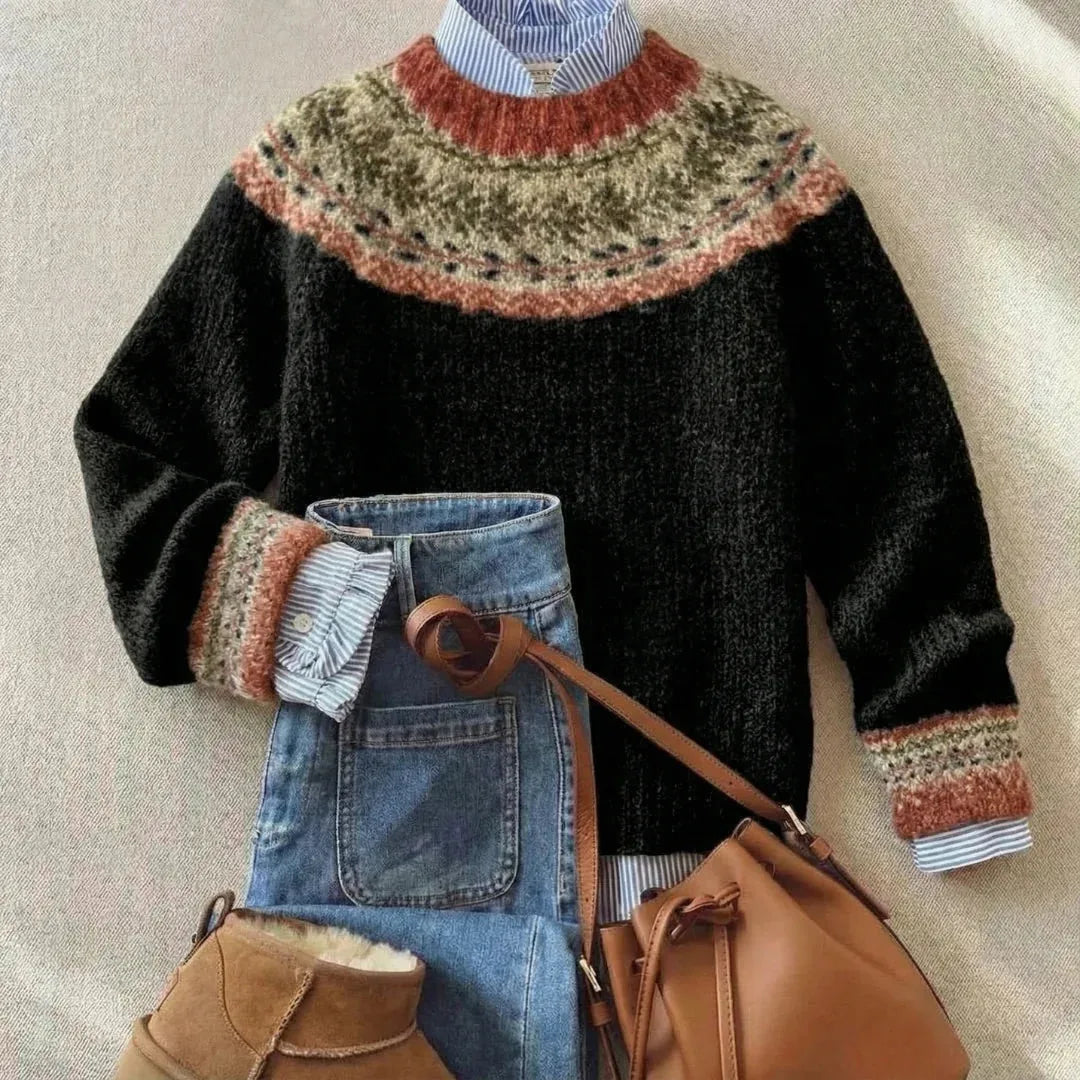 Black jumper with rust, olive and cream Fair Isle yoke and cuffs, layered over a striped collared shirt