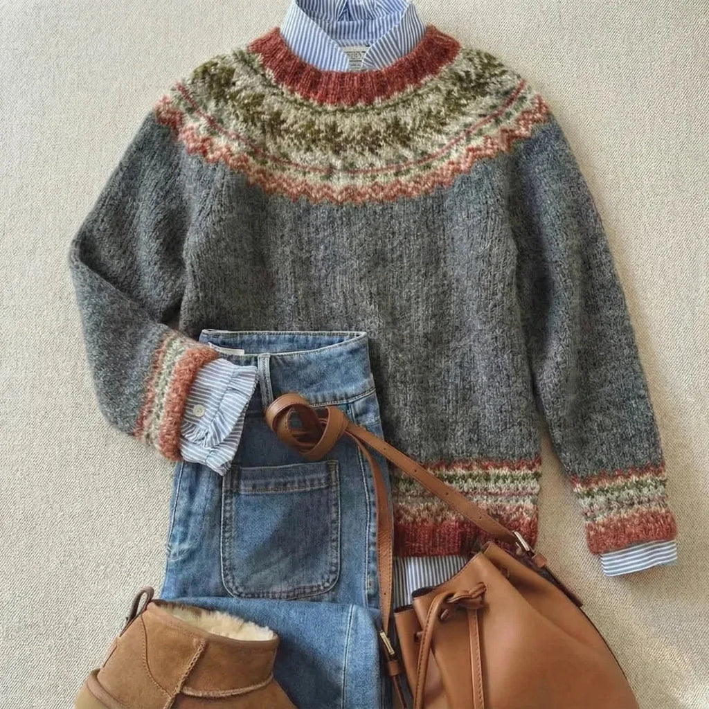 Charcoal grey jumper with a rust, olive and cream patterned yoke, paired with jeans, boots and a tan bag