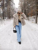 Side angle of the coat showing the relaxed sleeve shape and how it pairs with leather trousers