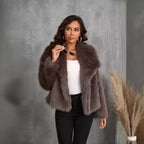 Street style shot of the model walking confidently in the black fur coat and leather trousers