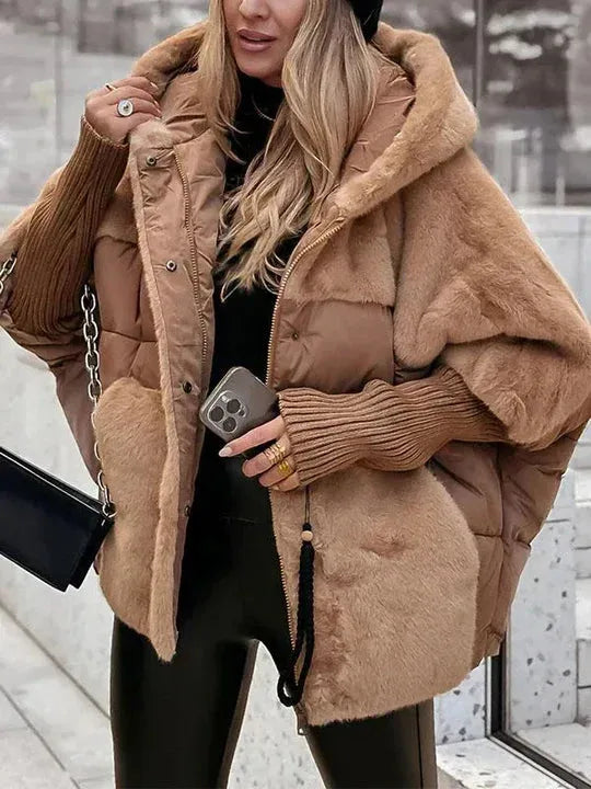 Brown quilted puffer jacket with faux fur trim, ribbed knit cuffs and hood, styled with a chain-strap bag