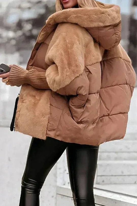 Side view of brown puffer jacket showing quilted body, faux fur hood and sleeve detail