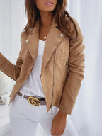 Detail shot of the caramel suede jacket lapel with silver hardware and side zip pocket