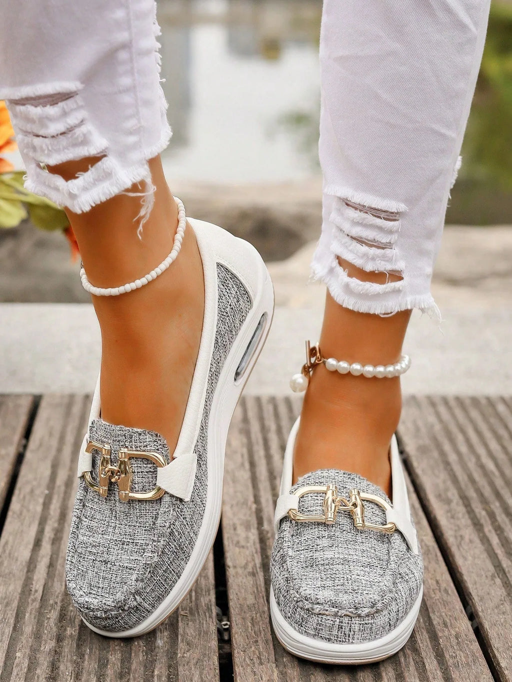 Close-up of yellow loafer sole and stitching detail with visible textured platform base