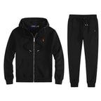 Black fleece full-zip hoodie and matching jogger tracksuit laid flat, showing red embroidered logo on chest
