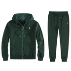 Dark green fleece hoodie and jogger set laid flat with yellow embroidered logo and ribbed hem