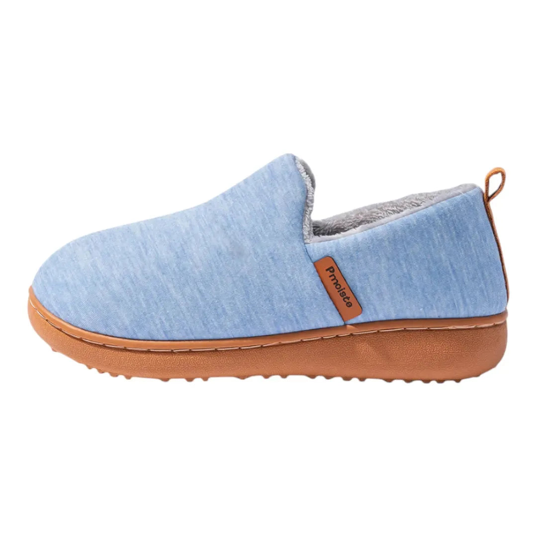 Front angled view of a black fleece lined slipper showing the soft grey interior lining