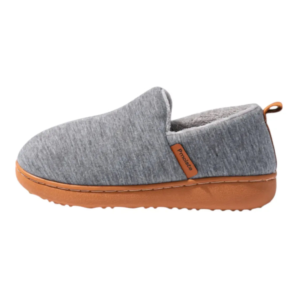 Pair of light grey slip-on slippers arranged to show both the soft upper and the grippy tan sole