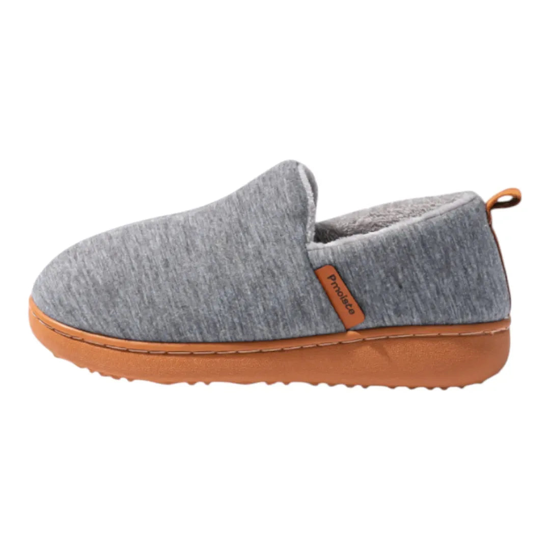 Pair of light grey slip-on slippers arranged to show both the soft upper and the grippy tan sole