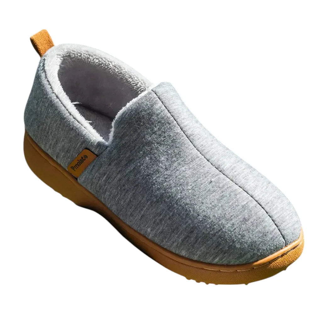 Side profile of a light grey marled slip-on slipper with a tan sole and heel pull tab