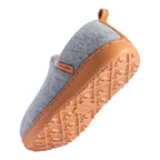 Angled view of a grey slip-on house shoe showing the plush fleece interior and tan trim