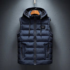 Dark navy padded gilet with fleece-lined hood, zip pockets and drawcord, shown hanging on a wooden hanger