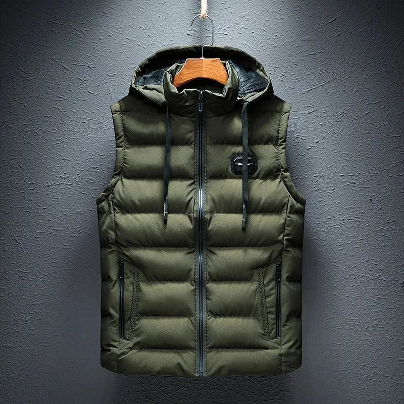 Army green quilted hooded gilet with full zip and drawstring hood, hanging against a grey wall