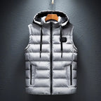 Light grey quilted hooded gilet with fleece-lined hood and zip pockets, hanging flat against the wall
