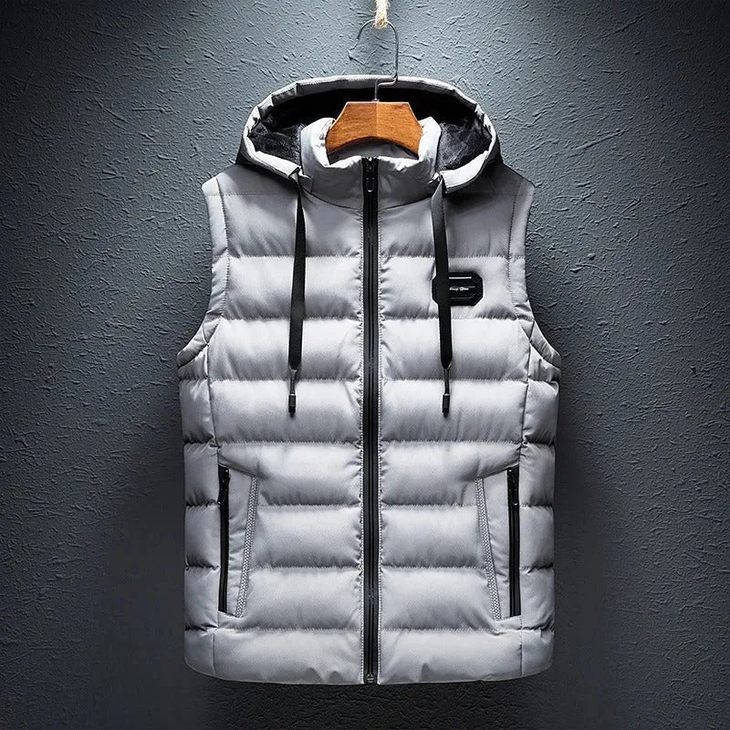 Light grey quilted hooded gilet with fleece-lined hood and zip pockets, hanging flat against the wall