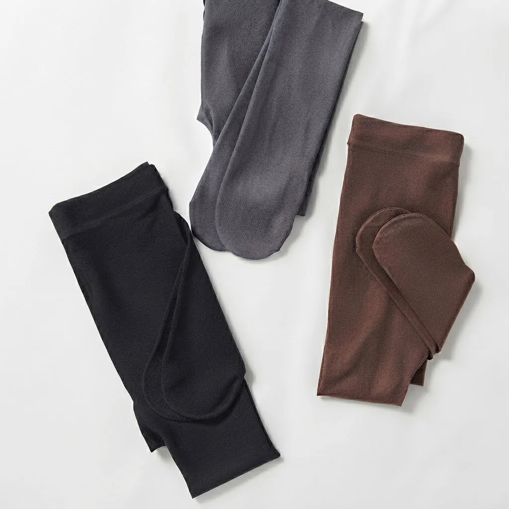 Flat lay of folded fleece-lined tights in black, grey and brown showing the brushed inner lining