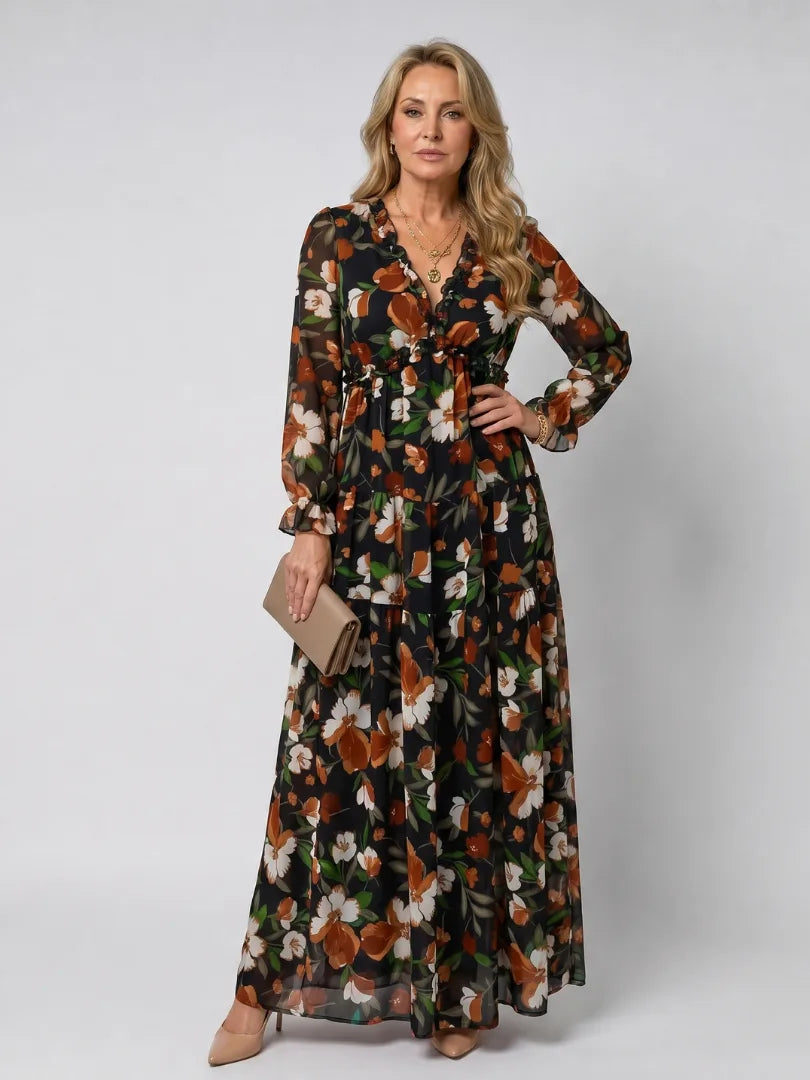 Black floral maxi dress with rust and cream blooms, ruffled trim and tiered skirt silhouette