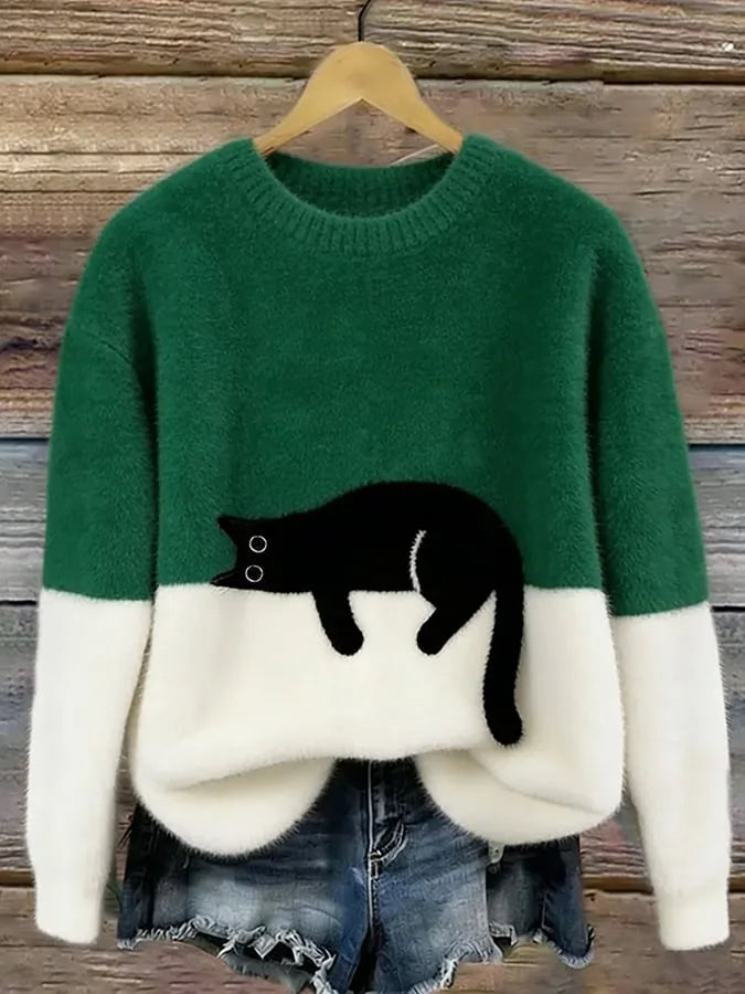 Green and cream two-tone fuzzy jumper with a black cat design placed at the colour-block line