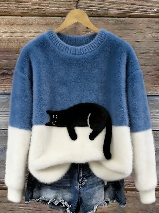 Denim blue and cream colour-block jumper with a plush black cat appliqué on the front