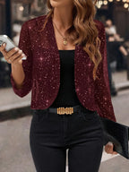 Burgundy glitter sequin open cardigan jacket shown with long sleeves and a relaxed cropped fit