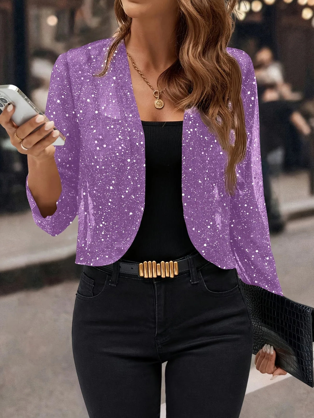 Purple sparkly cropped cardigan jacket with allover glitter speckle worn open over a black cami