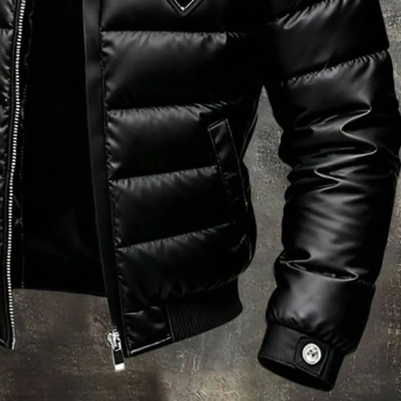 Close-up of the padded sleeve cuff with button strap, showing the ribbed hem and side pocket of the jacket