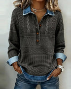 Front view of a grey cable and geometric knit jumper with contrast denim-style collar and rolled cuffs