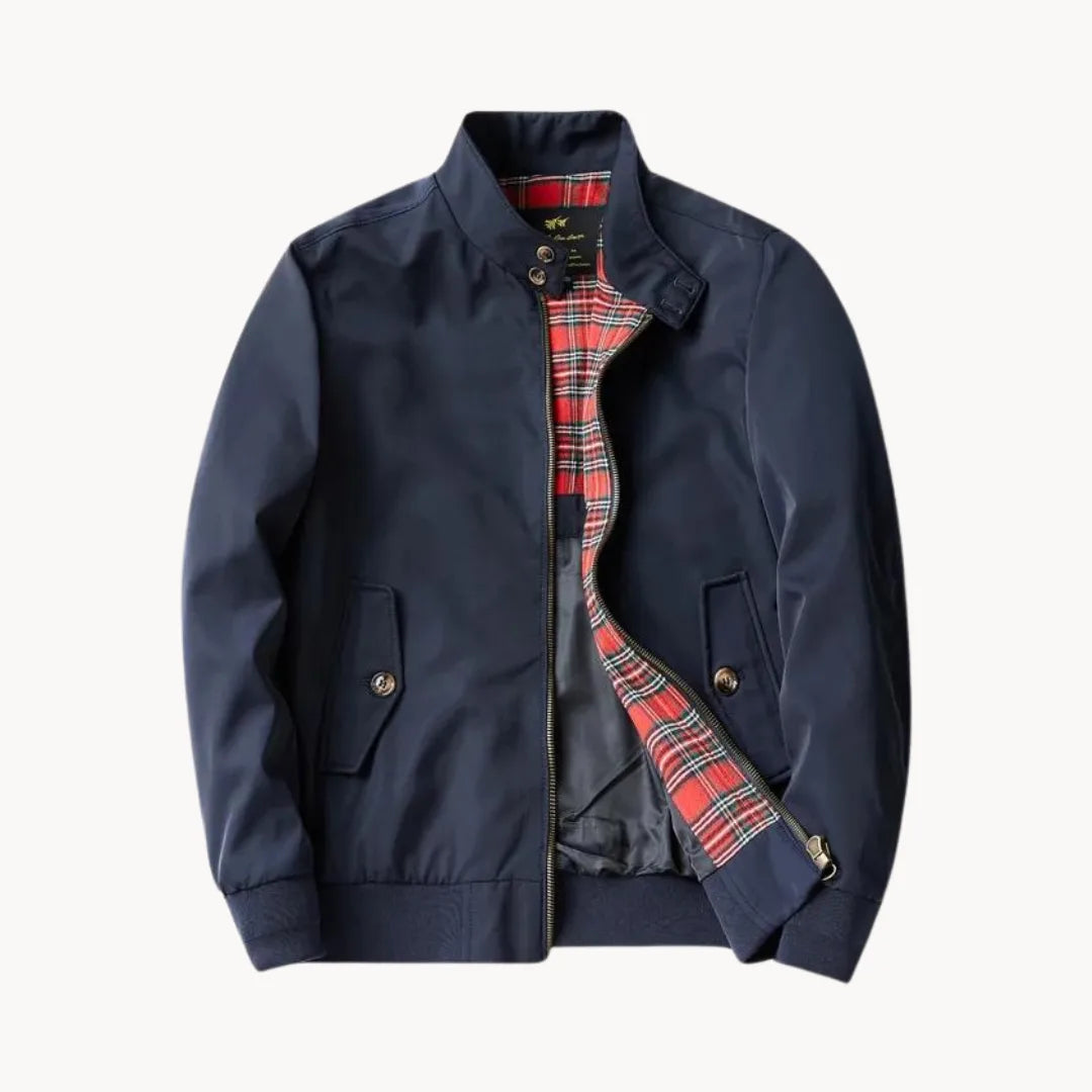 Navy blue Harrington jacket laid flat, fully unzipped, showing red tartan lining and stand collar