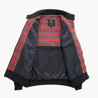 Black Harrington jacket laid open from the back view, revealing full red tartan interior lining