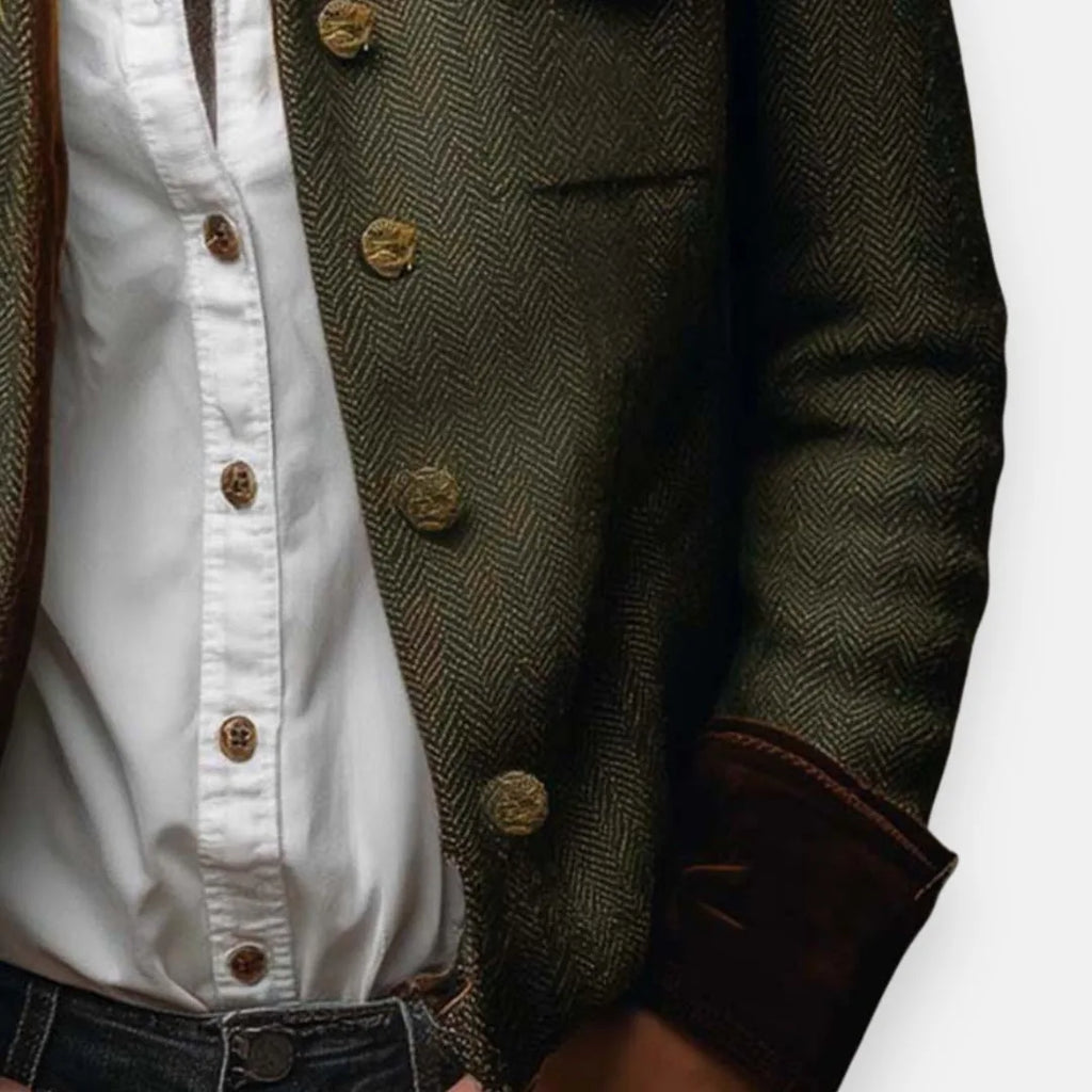 Close-up of the herringbone tweed weave, antique brass buttons and stitched seam detail