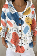 White hooded button jacket featuring bold abstract shapes in terracotta, mustard and navy with fine line art detail