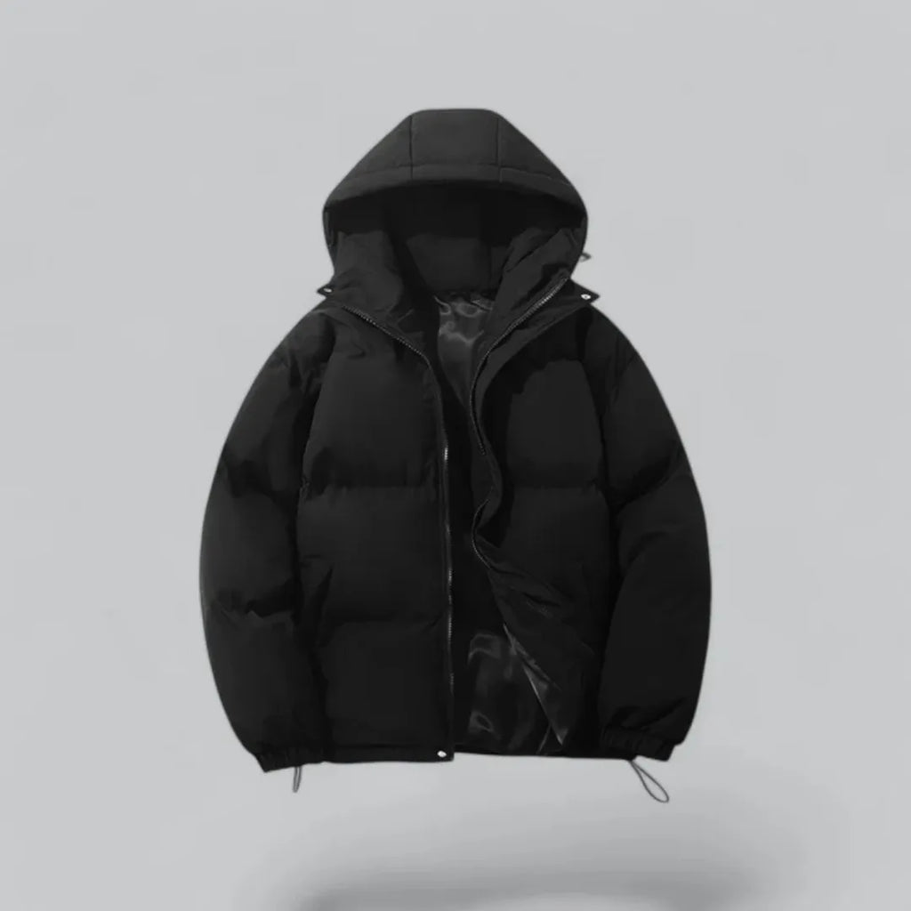 Black quilted hooded puffer jacket with zip half open, drawstring hem visible at the bottom