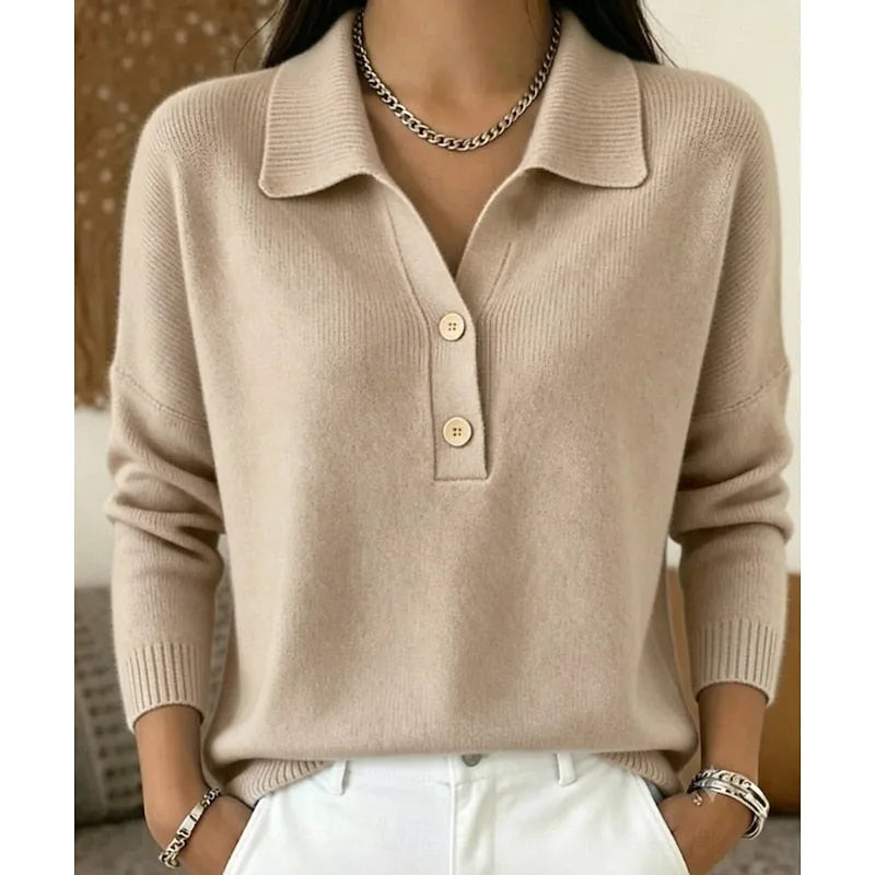 Khaki knitted polo-style jumper showing ribbed cuffs and collar detail, styled with white trousers and bracelets.